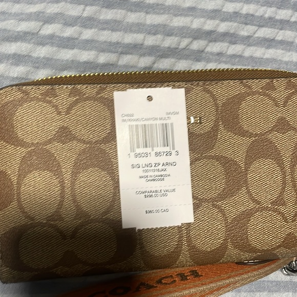 $90 EACH. Coach wristlet. Larger wallet use. Available in brown and black - Picture 5 of 6